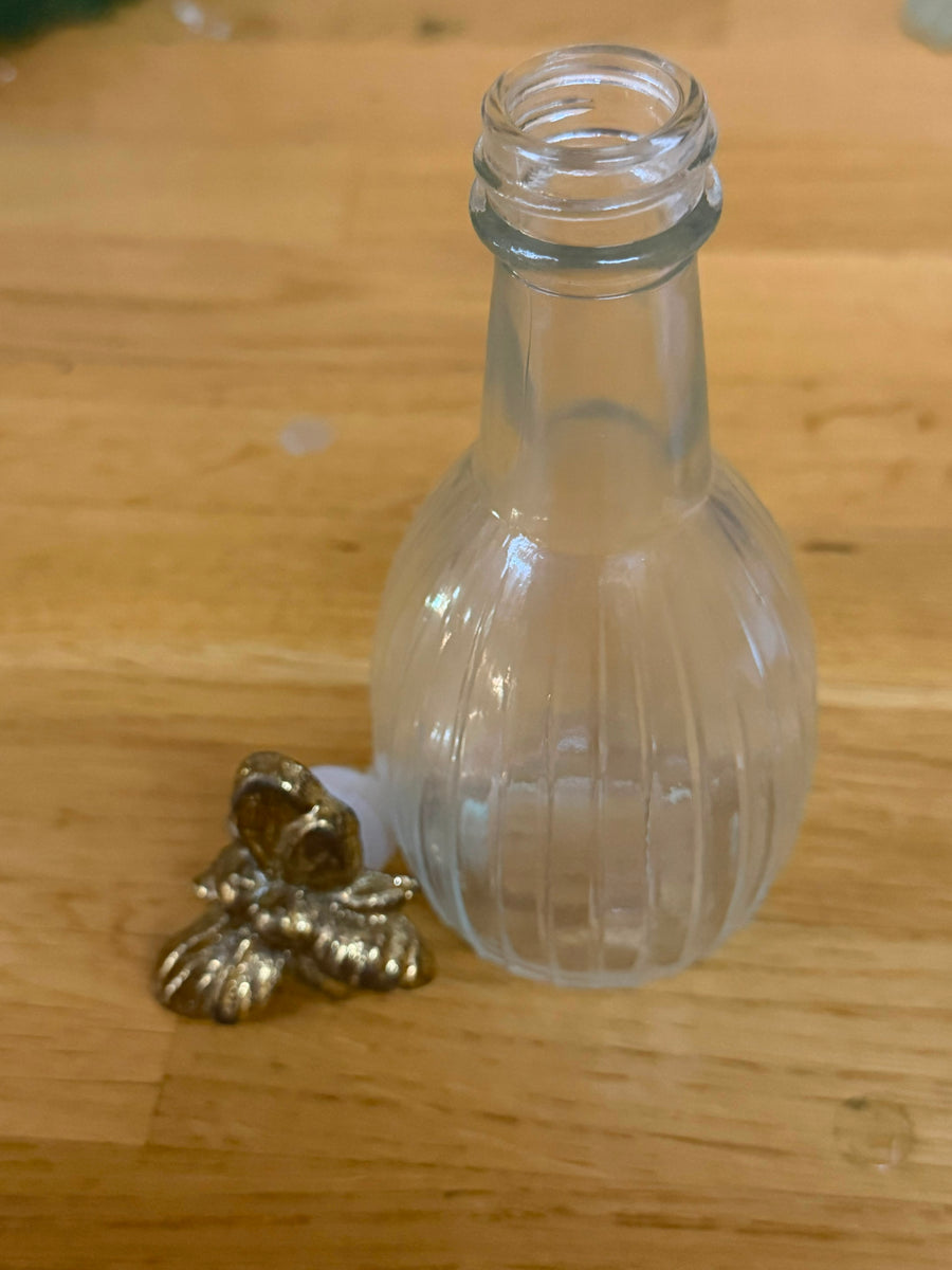 The Ritual Vessel — Ridged Glass Bottle with Golden Bee Stopper